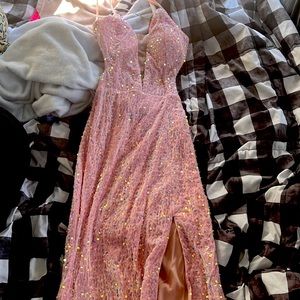 Prom dress with a open back, filled with sequins, a leg cut out and side cut out